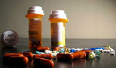 pill bottles and pills on a table