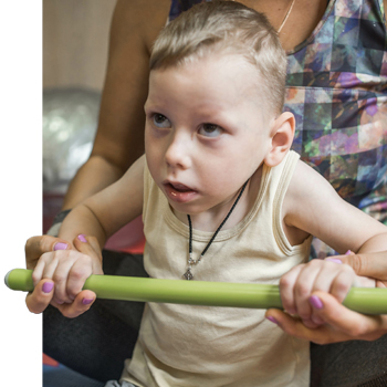 Child with cerebral palsy engaged in physical therapy