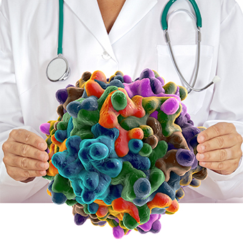 Female physician holding up huge virus