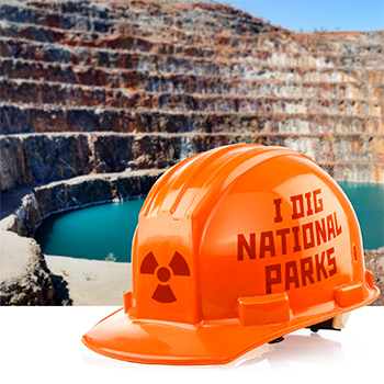 Orange hard hat with 'I dig national parks' and radiation symbol laid over photo of uranium strip mine