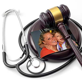 Gavel, stethoscope and photo of child with cerebral palsy and her mother