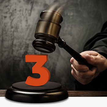 Judge bringing gavel down on orange number three