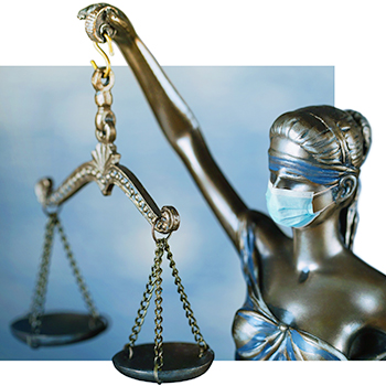 Closeup of Lady Justice wearing a face mask