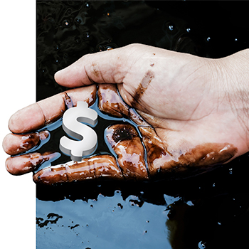 Man's hand cupping spilled crude oil with dollar sign floating in palm