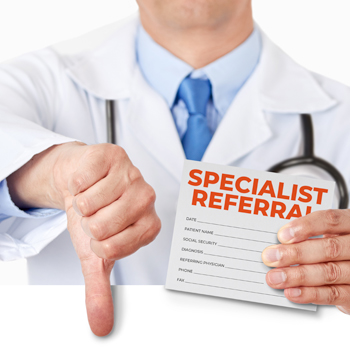 Doctor holding specialist referral form in right hand, left hand is thumb down