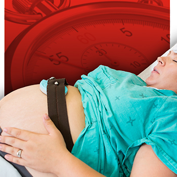 woman in labor wearing fetal heart monitor with stopwatch on red background