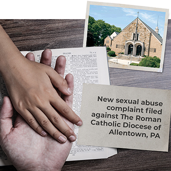 Adult holding child's hand over bible